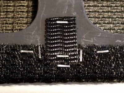 Cut grille cloth at middle Velcro.