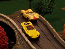 Dune Buggy and McLaren Elva on the hill.