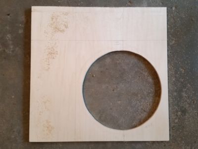 Plywood with the hole cut.
