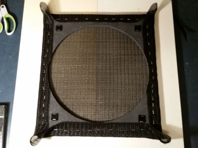 Stapled grille cloth.